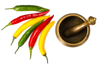 Colorful chili peppers on a white background
