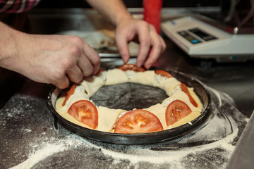 Chef making a pizza
