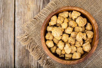 Grude soybean stew on the background of wooden boards