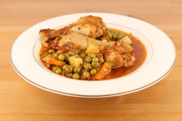 chicken and pea meal on white plate