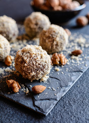 Unbaked sweet balls made of walnut, cocoa and almond