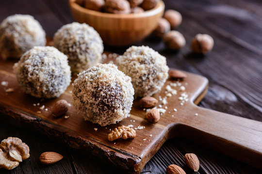 Unbaked sweet balls made of walnut, cocoa and almond