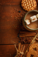 Composition of cocoa in cup with marshmallow, biscuit cookies, a