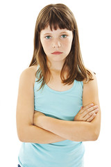 Fototapeta premium Sulky angry young girl child, sulking and pouting. Isolated on white background 
