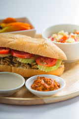 sandwich shawarma chicken in a baguette middle eastern food	restaurant menu day time