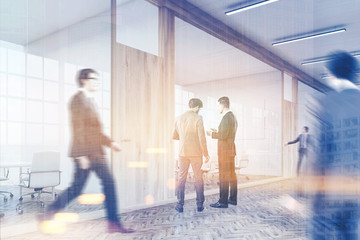 Obraz premium Gentlemen walking in business center lobby