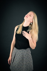 Fototapeta premium Beautiful woman doing different expressions in different sets of clothes: heart attack