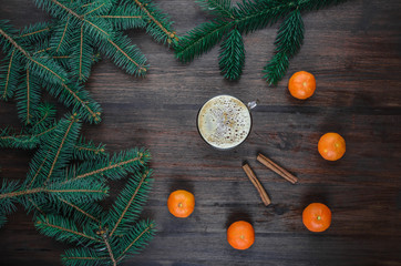 Christmas background with cinnamon sticks, coffee and tangerine