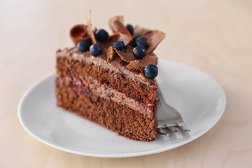 Delicious chocolate cake with blueberry on plate