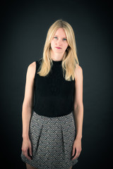 Fototapeta premium Beautiful woman doing different expressions in different sets of clothes: worried