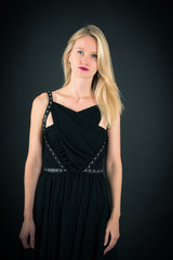 Fototapeta premium Beautiful woman doing different expressions in different sets of clothes: thinking