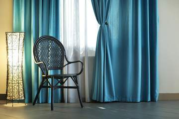 Chair, lamp and room window with white and blue curtains - Powered by Adobe