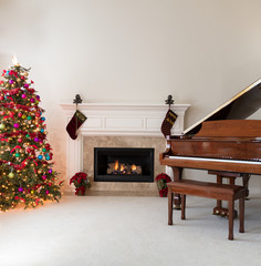 Living room with burning fireplace decorated for Christmas 