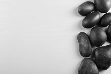 Fototapeta premium Spa stones on light background
