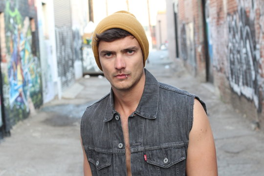 Fancy young male with beanie and piercing