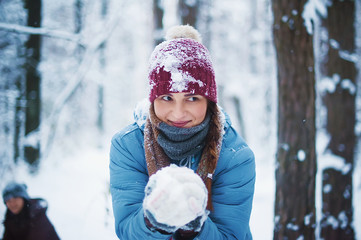 friends playing with snowballs. picture with soft focus. winter concept