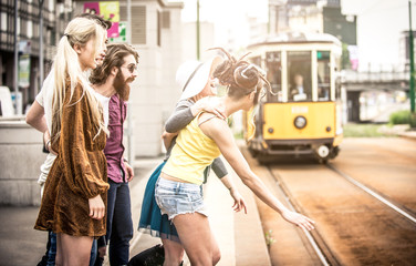 Group of teens waiting the tram