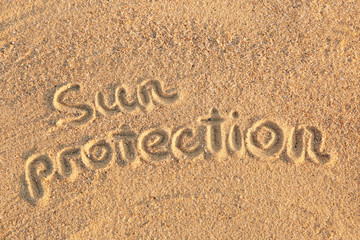 Handwritten inscription on sea sand, close up view