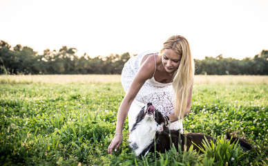 Beautiful woman with her loyal border collie