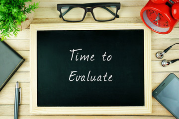 Top View Of Pen, Diary, Spectacle, Alarm Clock, Earphone, Smartphone and Chalkboard With Business...