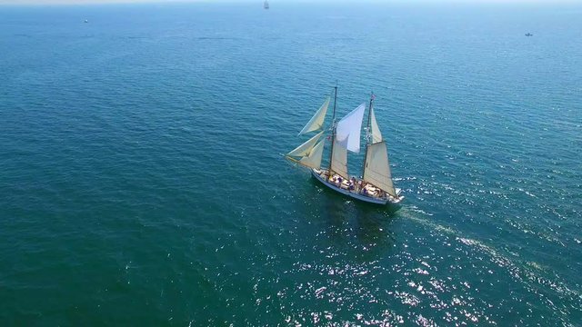 Tall ship at sea, majestic vessel sailing in open waters in good weather.
