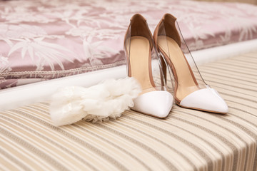 Fototapeta na wymiar shoes and bride's garter