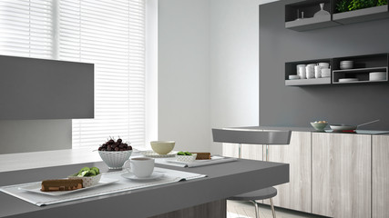 Minimalistic gray kitchen with wooden and gray details, vegetari