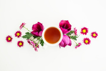 Obraz na płótnie Canvas Flowers and tea. Flat lay, Top view.