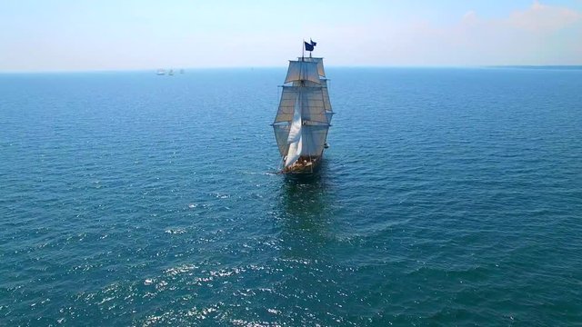 Tall ship at sea, majestic vessel sailing in open waters in good weather.
