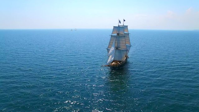 Tall ship at sea, majestic vessel sailing in open waters in good weather.
