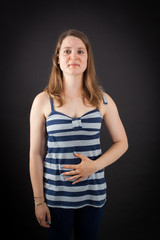 Beautiful woman doing different expressions in different sets of clothes: hungry