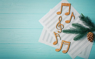 Christmas musical composition on wooden background