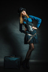 Fototapeta na wymiar Steampunk girl with retro bag.