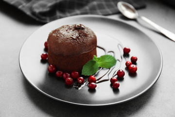Chocolate fondant with berries on plate