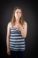 Beautiful woman doing different expressions in different sets of clothes: suspicion