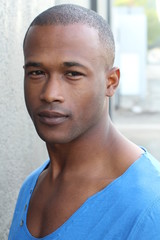 Striking man with neutral expression close up