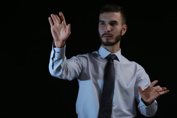 Businessman hands  on dark background