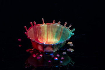 Liquid art falling coloured drop impacting on a surface producing a form of artistic image
