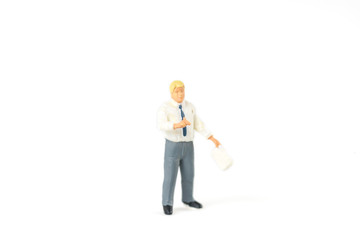 Miniature businessman on white background with a space for text