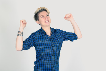 Beautiful woman doing different expressions in different sets of clothes: arms raised