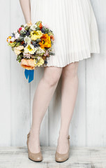 Woman holding big bouquet of flowers