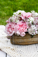 Floral arrangement with pink carnations