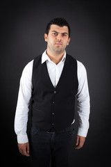 Handsome man doing different expressions in different sets of clothes: angry