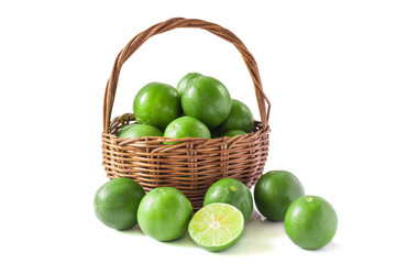 Green lemon in the basket isolated background