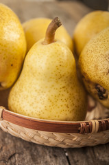 
Delicious Williams or Bartlett pears on a rustic wooden kitchen table