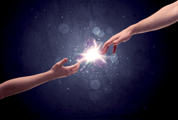 Hands reaching to light a spark