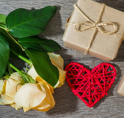 composition for Valentine's day, wedding, flowers, heart on wooden background