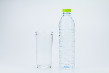 Water bottle and glass of full water on white background