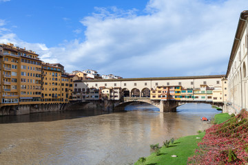 Ponte Vecchio over Arno river in sunny autumn day
