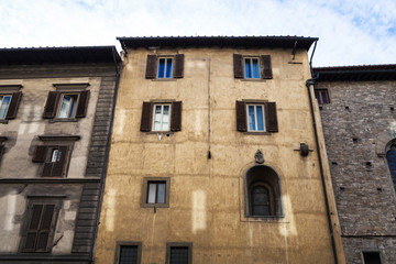 Fototapeta na wymiar facades of old apartment buildings in Florence